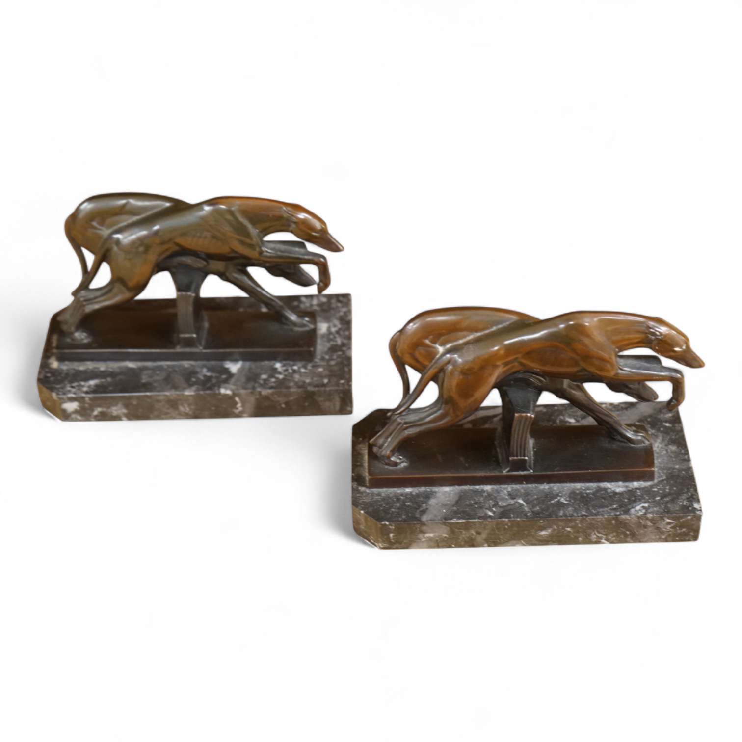 A pair of French Art Deco spelter bookends in the form of racing greyhounds, 14.5cm wide